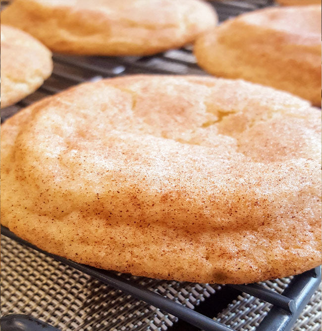 Single snickerdoodle cookie rolled in cinnamon sugar